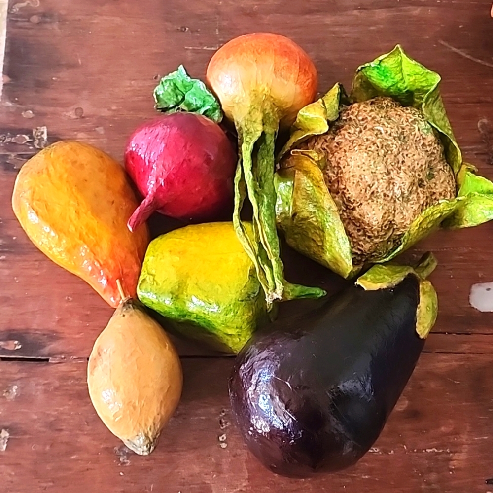 One set of seven paper Mache Colored Vegetables/fruits